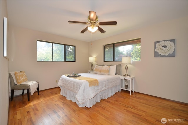 18215 108th Ave NE, Bothell, WA 98011 - bedroom with light wood finished floors and a ceiling fan