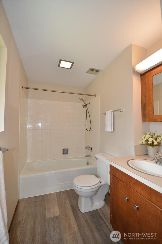 18215 108th Ave NE, Bothell, WA 98011 - full bathroom featuring wood finished floors, tub / shower combination, vanity, and toilet