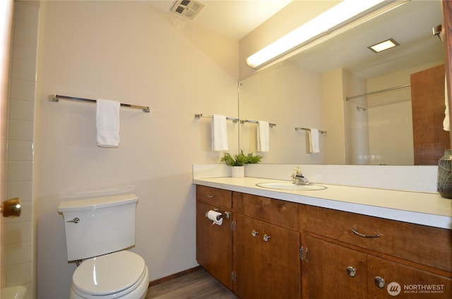 18215 108th Ave NE, Bothell, WA 98011 - bathroom featuring toilet, vanity, a shower, baseboards, and wood finished floors