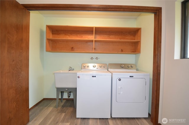 18215 108th Ave NE, Bothell, WA 98011 - laundry room with washing machine and dryer, light wood-type flooring, and baseboards