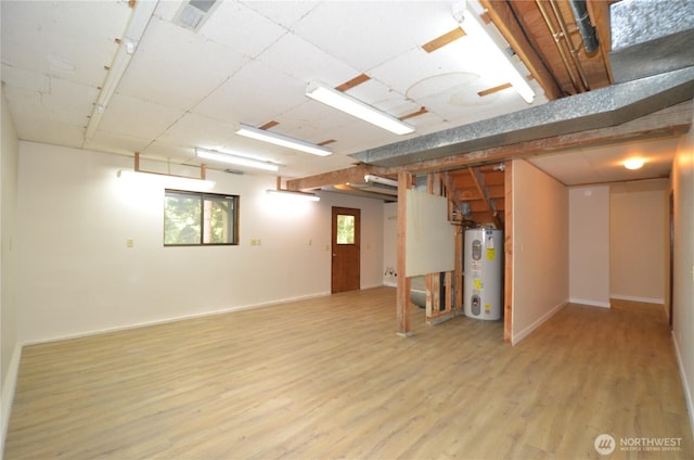 18215 108th Ave NE, Bothell, WA 98011 - basement featuring water heater, light wood-style floors, and baseboards