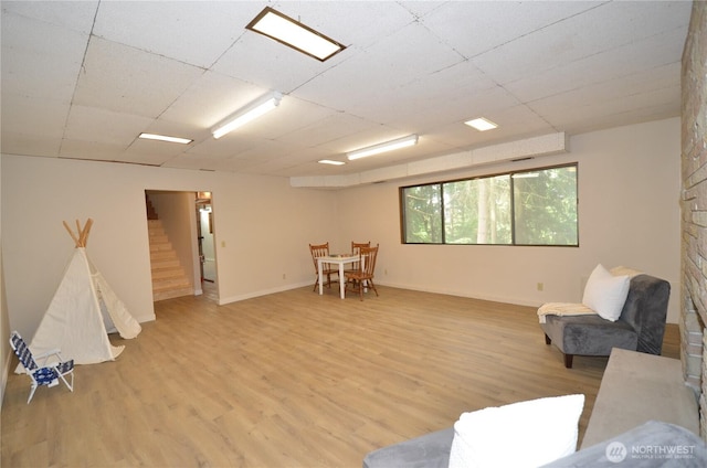 18215 108th Ave NE, Bothell, WA 98011 - living area with stairs, light wood-type flooring, and baseboards