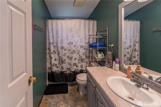 1822 W Devanny Ln, Port Angeles, WA 98363 - full bathroom with vanity, toilet, and tile patterned flooring