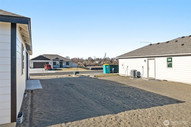 4214 W Sandy Ct, Moses Lake, WA 98837 - view of yard with central AC and a residential view
