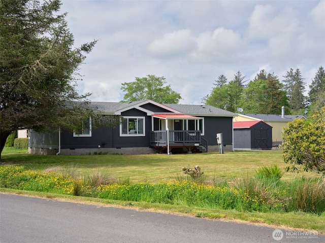 7127 Ortelius Dr, Ilwaco, WA 98624 - ranch-style house featuring crawl space, a front yard, and a wooden deck