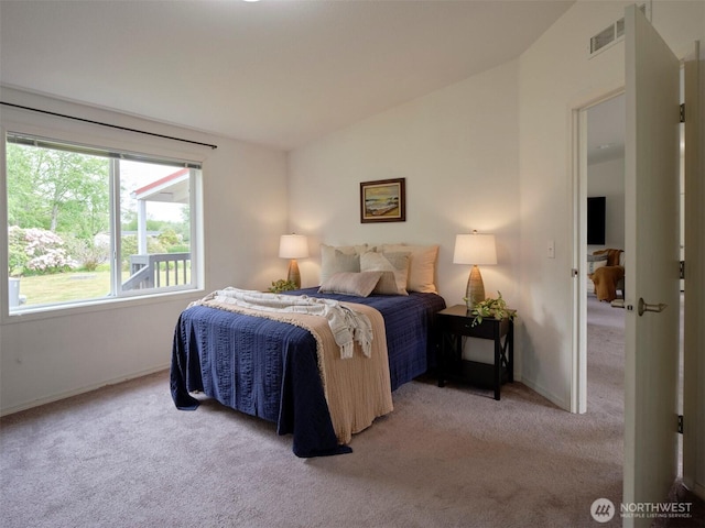 7127 Ortelius Dr, Ilwaco, WA 98624 - bedroom featuring carpet floors, vaulted ceiling, and baseboards