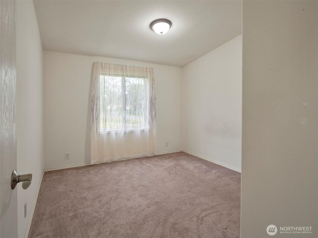 7127 Ortelius Dr, Ilwaco, WA 98624 - empty room with carpet flooring and baseboards