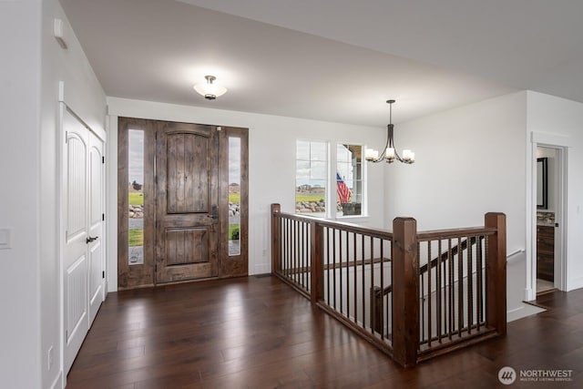 7328 Stonecrest Rd NE, Moses Lake, WA 98837 - entryway featuring dark wood-style floors, a chandelier, and baseboards
