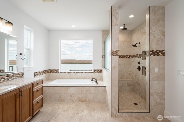 7328 Stonecrest Rd NE, Moses Lake, WA 98837 - full bathroom featuring vanity, a bath, tiled shower, and recessed lighting