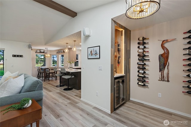 1361 E Old Ranch Rd, Allyn, WA 98524 - wine room with wine cooler, light wood finished floors, plenty of natural light, and baseboards