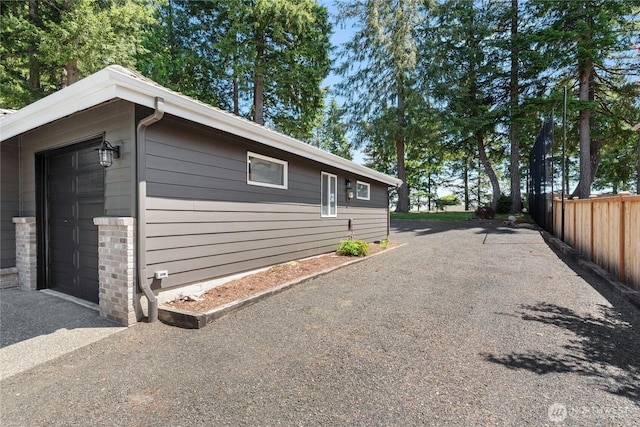 1361 E Old Ranch Rd, Allyn, WA 98524 - view of home's exterior with a garage