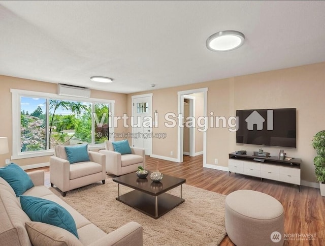 2914 Columbia Heights Rd, Longview, WA 98632 - living room with a wall mounted air conditioner, wood finished floors, and baseboards