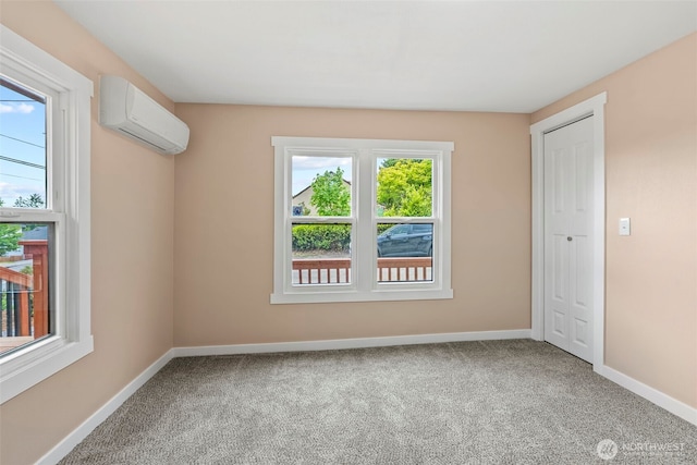 2914 Columbia Heights Rd, Longview, WA 98632 - unfurnished room featuring a wall mounted air conditioner, carpet flooring, and baseboards