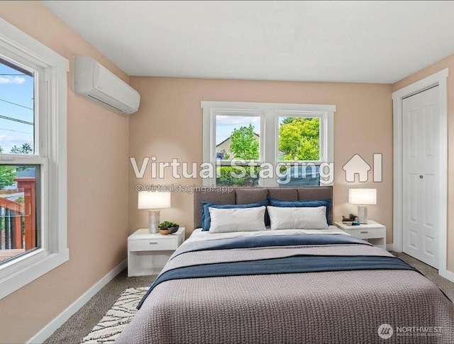 2914 Columbia Heights Rd, Longview, WA 98632 - bedroom featuring a wall mounted AC, baseboards, and carpet floors
