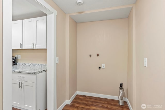 2914 Columbia Heights Rd, Longview, WA 98632 - washroom with cabinet space, hookup for an electric dryer, dark wood finished floors, and baseboards