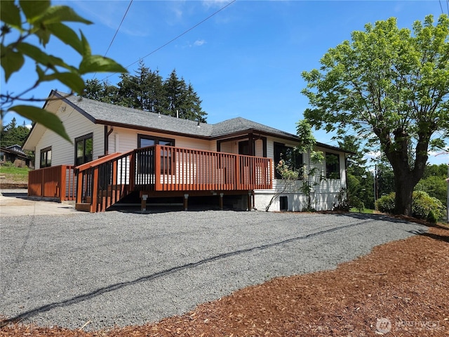 2914 Columbia Heights Rd, Longview, WA 98632 - back of property with a wooden deck and roof with shingles