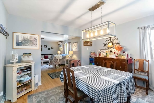 2337 W Castleman St, Longview, WA 98632 - dining area with wood finished floors and an AC wall unit