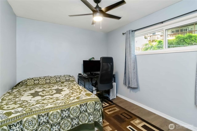 2337 W Castleman St, Longview, WA 98632 - bedroom with dark wood finished floors, baseboards, and a ceiling fan