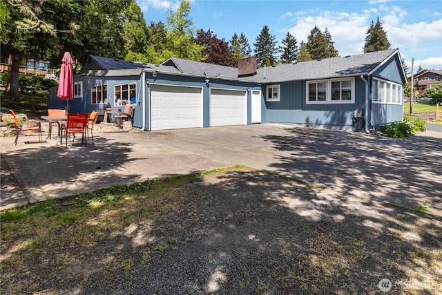 2337 W Castleman St, Longview, WA 98632 - ranch-style home featuring a garage, a chimney, concrete driveway, and roof with shingles
