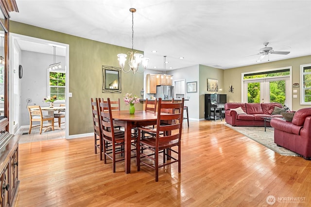 1933 Valleybrook Ln, Bellingham, WA 98229 - dining space with light wood-style floors, a ceiling fan, baseboards, recessed lighting, and a chandelier