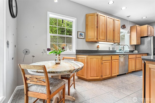 1933 Valleybrook Ln, Bellingham, WA 98229 - kitchen with stainless steel appliances, dark countertops, recessed lighting, light tile patterned floors, and a sink