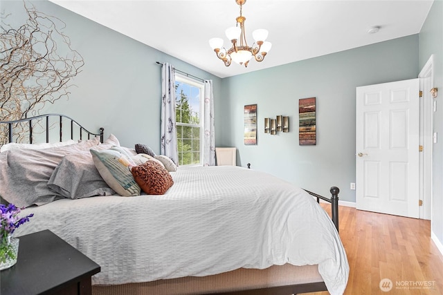 1933 Valleybrook Ln, Bellingham, WA 98229 - bedroom with a chandelier, light wood-style floors, and baseboards