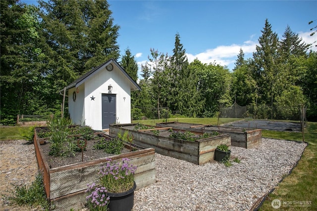 1933 Valleybrook Ln, Bellingham, WA 98229 - view of yard featuring a vegetable garden and an outbuilding