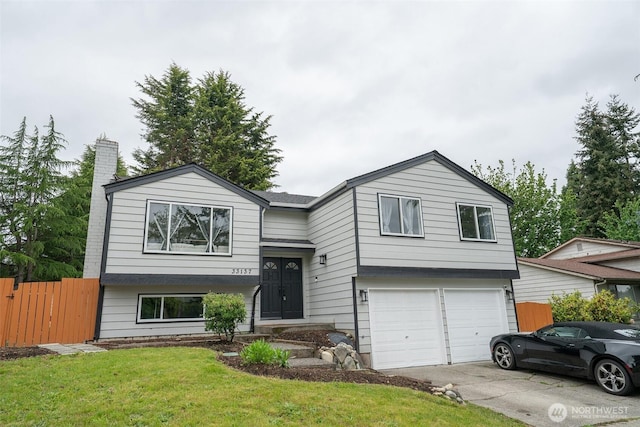 33137 35th Ave SW, Federal Way, WA 98023 - view of front of house featuring driveway, an attached garage, and a chimney