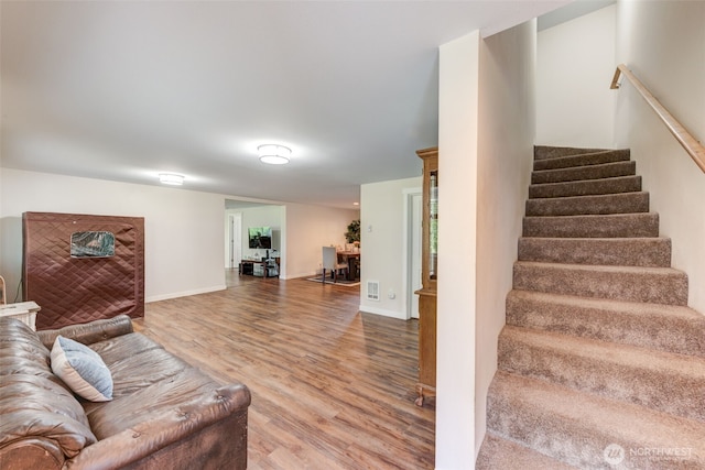 4718 252nd St NE, Arlington, WA 98223 - living room with wood finished floors, stairway, and baseboards