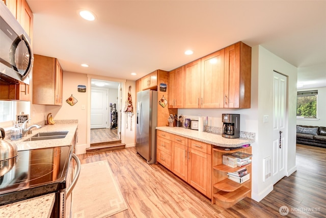 4718 252nd St NE, Arlington, WA 98223 - kitchen featuring appliances with stainless steel finishes, a sink, light wood-style flooring, recessed lighting, and open shelves