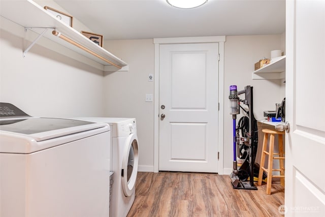 4718 252nd St NE, Arlington, WA 98223 - laundry area with separate washer and dryer, light wood-style floors, and baseboards