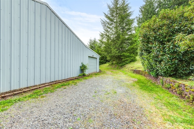 4718 252nd St NE, Arlington, WA 98223 - view of yard featuring a garage and driveway
