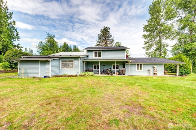 4718 252nd St NE, Arlington, WA 98223 - back of property featuring a yard and a patio