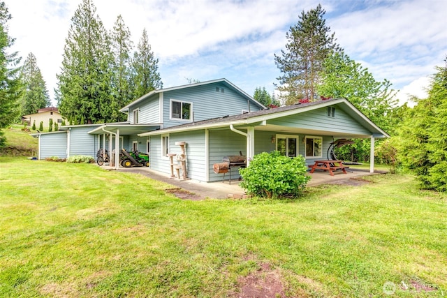 4718 252nd St NE, Arlington, WA 98223 - rear view of house with a lawn and a patio