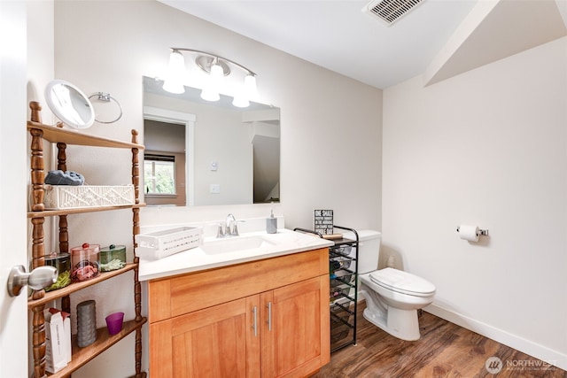4718 252nd St NE, Arlington, WA 98223 - bathroom featuring toilet, vanity, wood finished floors, baseboards, and lofted ceiling
