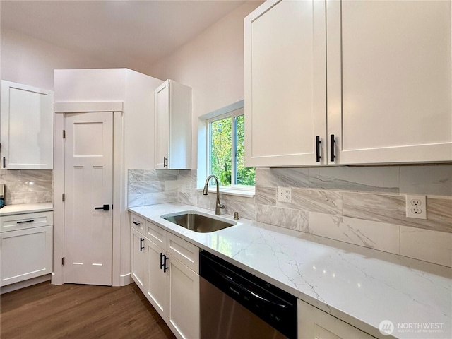 127 Olympic View Ave NE, Ocean Shores, WA 98569 - kitchen featuring stainless steel dishwasher, white cabinets, light stone counters, decorative backsplash, and dark wood-style flooring