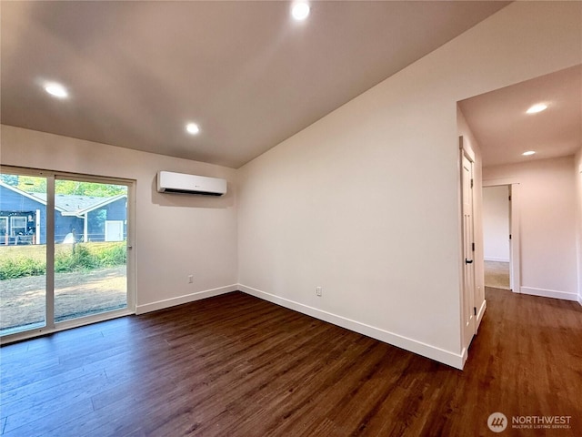 127 Olympic View Ave NE, Ocean Shores, WA 98569 - spare room with a wall mounted air conditioner, dark wood-type flooring, and recessed lighting