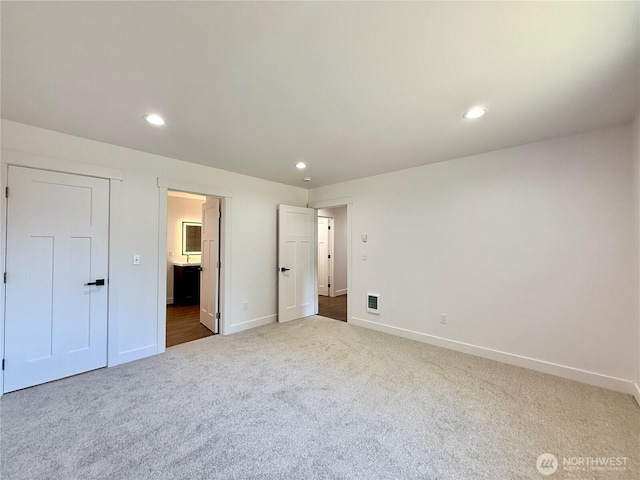 127 Olympic View Ave NE, Ocean Shores, WA 98569 - unfurnished bedroom featuring carpet flooring, recessed lighting, and ensuite bathroom