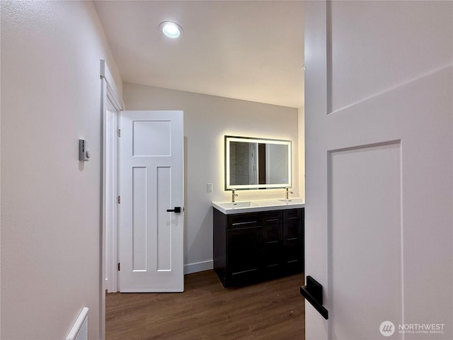 127 Olympic View Ave NE, Ocean Shores, WA 98569 - full bath with double vanity, wood finished floors, and recessed lighting