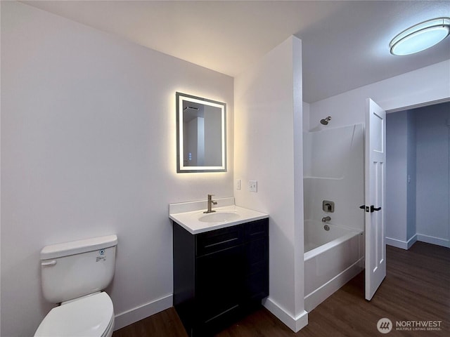 127 Olympic View Ave NE, Ocean Shores, WA 98569 - bathroom with vanity, wood finished floors, and bathtub / shower combination