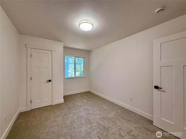 127 Olympic View Ave NE, Ocean Shores, WA 98569 - empty room with carpet floors and a smoke detector