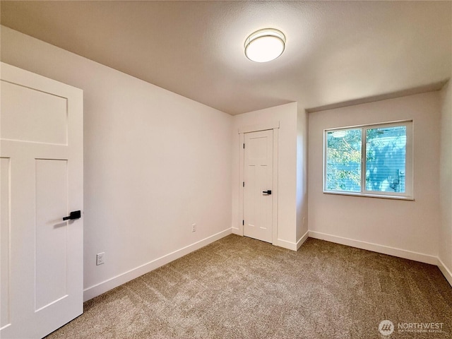 127 Olympic View Ave NE, Ocean Shores, WA 98569 - carpeted spare room featuring baseboards