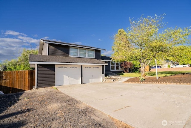 306 Belmont Ave, Moses Lake, WA 98837 - tri-level home featuring concrete driveway and a garage