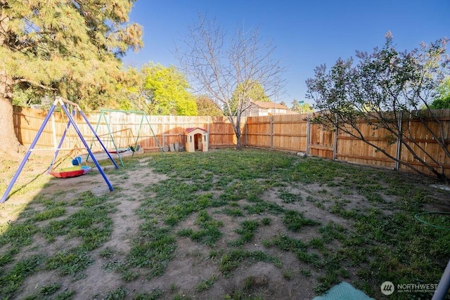306 Belmont Ave, Moses Lake, WA 98837 - fenced backyard with a playground