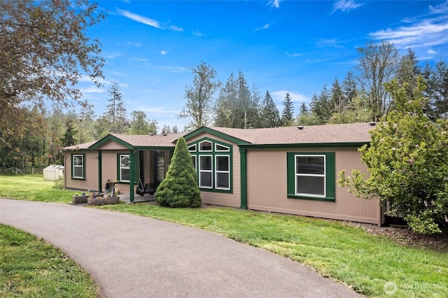 119 Oyler Way, Ethel, WA 98542 - view of front facade with a front yard and a shingled roof