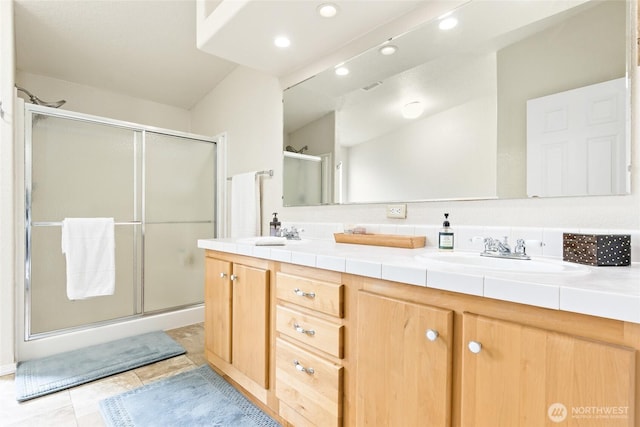 119 Oyler Way, Ethel, WA 98542 - bathroom featuring a shower stall, double vanity, tile patterned flooring, and recessed lighting