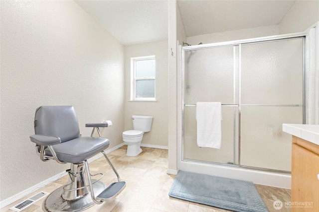 119 Oyler Way, Ethel, WA 98542 - full bath featuring a stall shower, toilet, baseboards, and tile patterned flooring