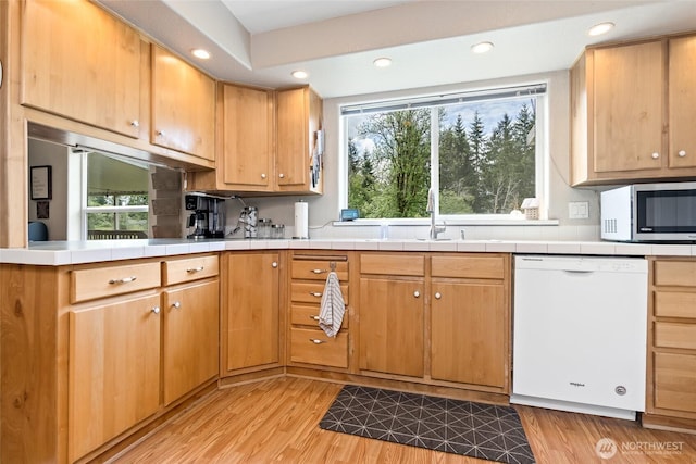 119 Oyler Way, Ethel, WA 98542 - kitchen featuring dishwasher, stainless steel microwave, tile countertops, plenty of natural light, and recessed lighting