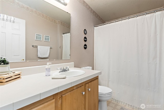119 Oyler Way, Ethel, WA 98542 - full bathroom featuring vanity, toilet, a textured wall, and a shower with curtain