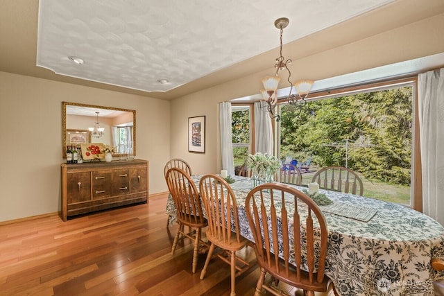 5990 6th Ave SE, Lacey, WA 98503 - dining area with a chandelier and hardwood / wood-style flooring